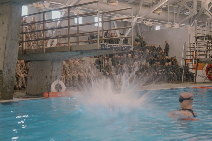 U.S. Marine Corps recruits with Bravo Company, 1st Recruit Training Battalion, participate in a swim qualification event at Marine Corps Recruit Depot San Diego, California, Aug. 13, 2024. The basic swim qualification consists of a 25-meter swim, tower jump into the water, four-minute tread, 25-meter pack swim, and an underwater gear shed. (U.S. Marine Corps photo by Cpl. Elliott A. Flood-Johnson)