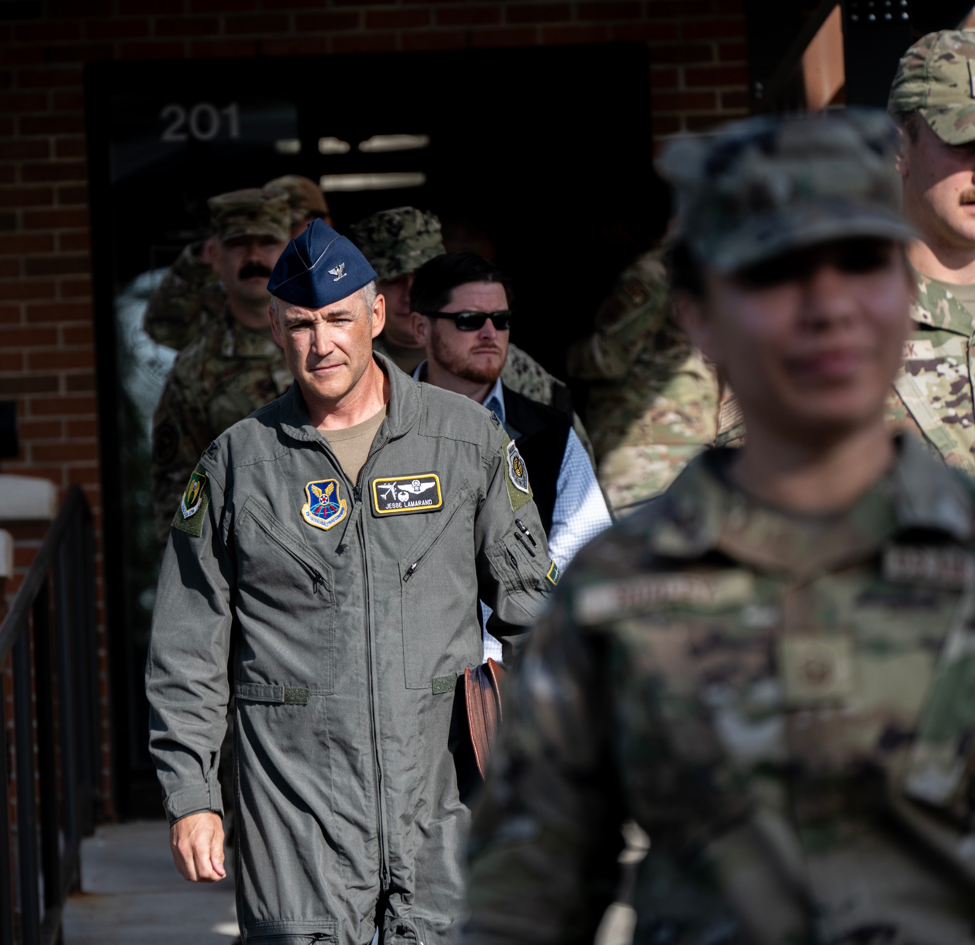 U.S. Air Force Col. Jesse Lamarand, 5th Bomb Wing commander, prepares to host a windshield tour of the base housing area for the Honorable Brendan Owens, Assistant Secretary of Defense for Energy, Installations and Environment, at Minot Air Force Base, North Dakota, Aug. 19, 2024. The purpose of this visit was to highlight the installation's modernization efforts while providing Owens an up-close and personal look at Team Minot's facilities and capabilities. (U.S. Air Force photo by Airman 1st Class Alyssa Bankston)
