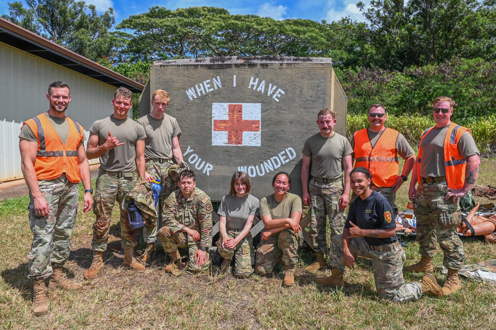 U.S. Airmen assigned to the 115th Fighter Wing pose for a photo with their local training instructor July 31, 2024, at Schofield Barracks Army Base, Hawaii. Airmen assigned to the 115 MDG completed a two-week Medical Facility Annual Training on the island of Oahu to maintain mission readiness. (U.S. Air National Guard photo by Master Sgt. Mary Greenwood)