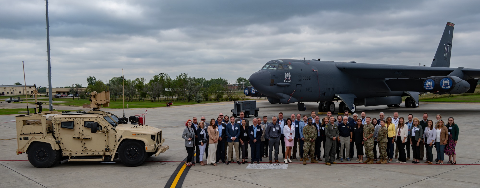 Civic Leadership Delegation pose with Minot Air Force Base leadership for a group photo at Minot AFB, North Dakota, Aug. 20, 2024. The tour was intended to build camaraderie and enhance understanding between the military and the civilian community. (U.S. Air Force photo by Airman 1st Class Alyssa Bankston)