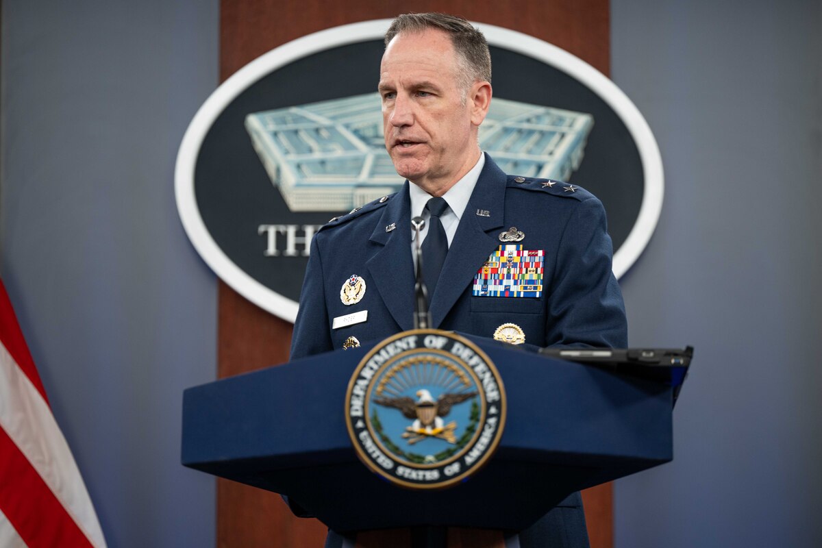 A military officer speaks from a lectern with the Pentagon logo in the background.