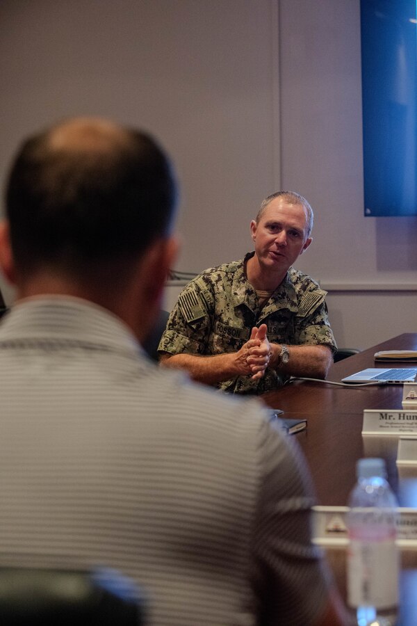 U.S. Navy Cmdr. Edward Fosson, the Marine Corps Air Station Iwakuni facilities officer and a native of North Carolina, discusses the current state of base housing and how to implement improvements with Patrick Nevins, the staff director of the House Armed Services Committee Readiness Subcommittee, during a base tour at MCAS Iwakuni, Japan, August 13, 2024. Patrick Nevins and other staff members visited MCAS Iwakuni to discuss base capabilities and ways to improve housing on the installation. (U.S. Marine Corps photos by Lance Cpl. Micah Taylor)