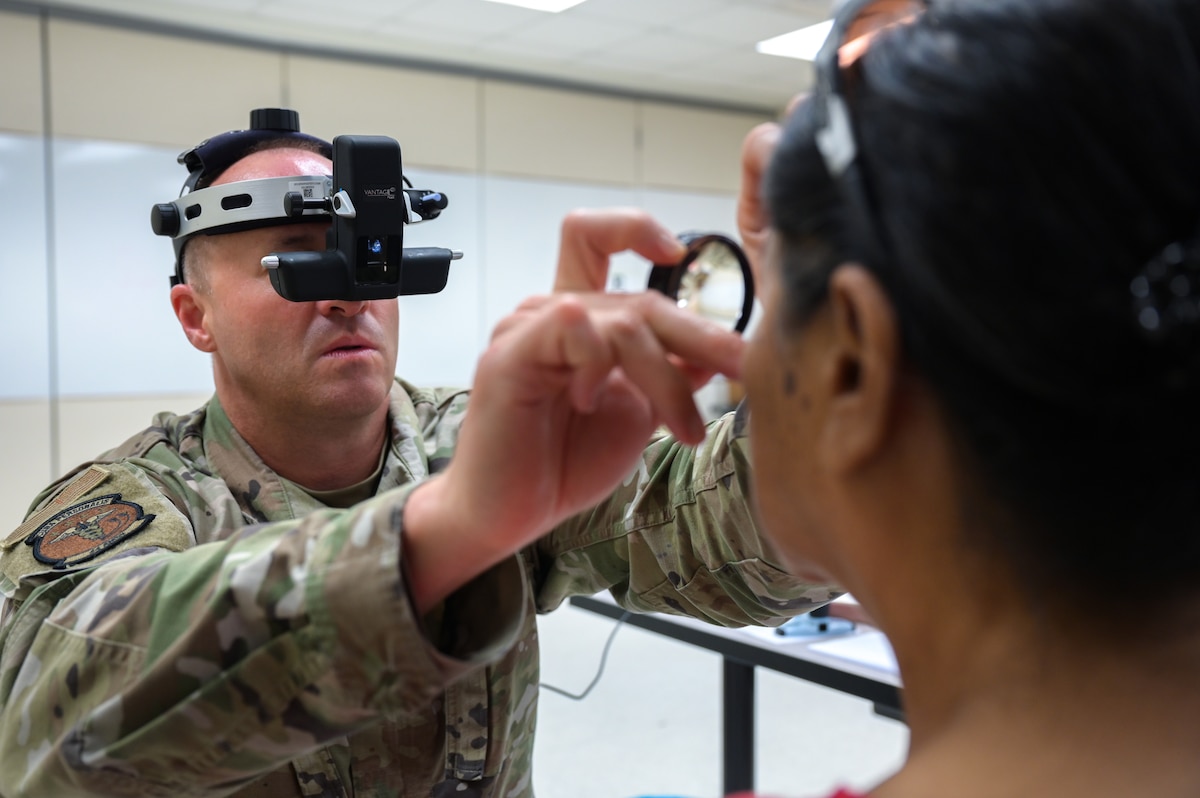 Image of Airmen supporting civilians.
