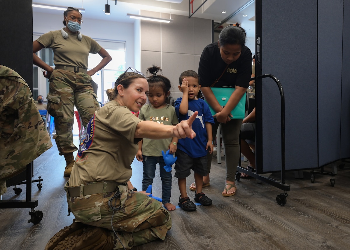 Image of Airmen supporting civilians.