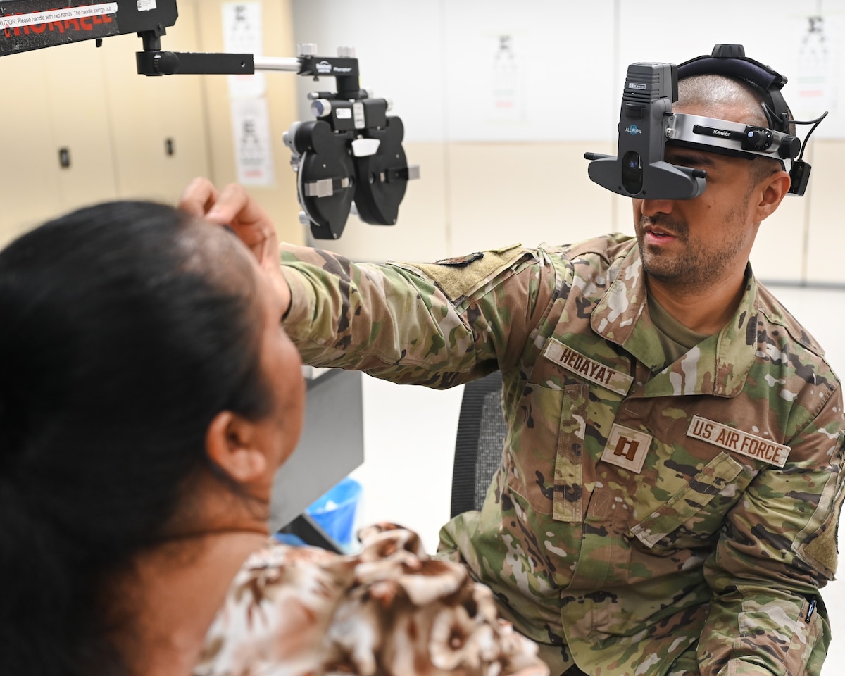 Image of Airmen supporting civilians.