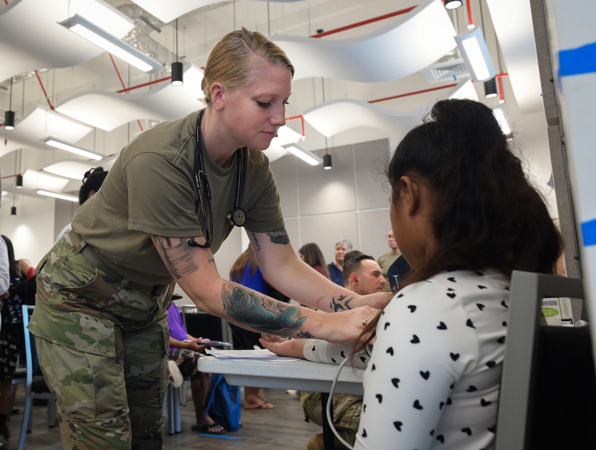 Image of Airmen supporting civilians.