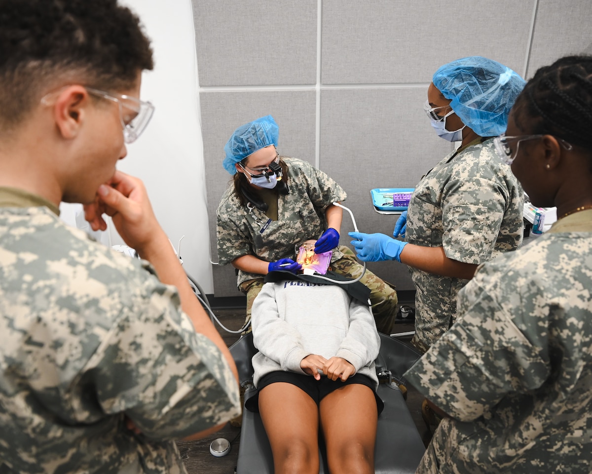 Image of Airmen supporting civilians.