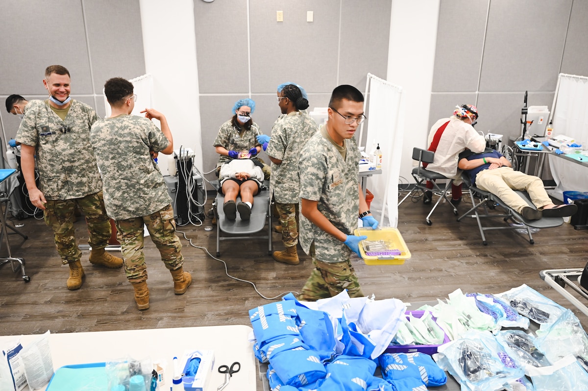 Image of Airmen supporting civilians.