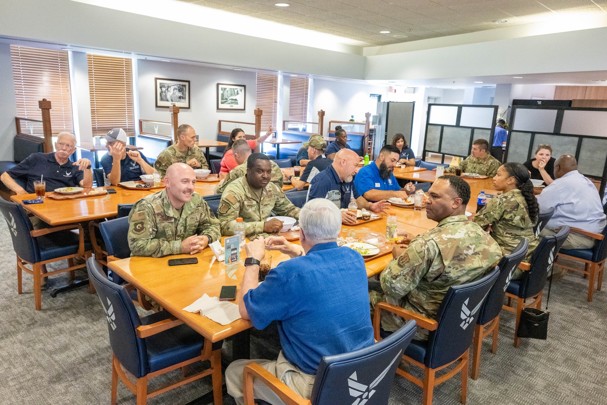 A group of honorary commanders eat lunch with members of the 436th Mission Support Group at Dover Air Force Base, Delaware, Aug. 15, 2024. The HCCs toured various elements of the 436th MSG to familiarize them with the group's mission and capabilities. (U.S. Air Force photo by Mauricio Campino)
