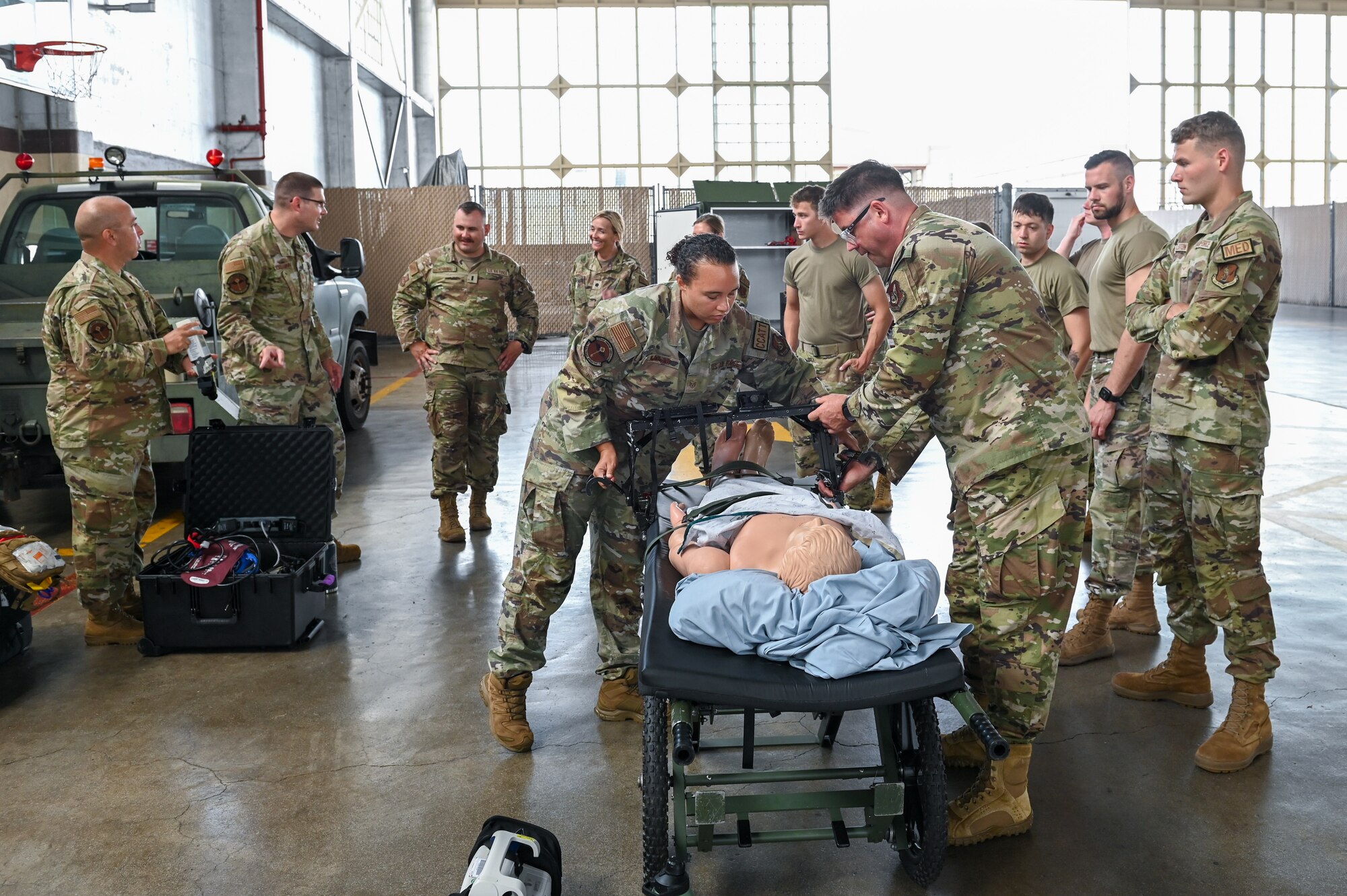 U.S. Airmen assigned to the 115th Fighter Wing perform critical air transport team training July 25, 2024, at Joint Base Pearl Harbor-Hickam, Hawaii. Airmen assigned to the 115 MDG completed a two-week Medical Facility Annual Training on the island of Oahu to maintain mission readiness. (U.S. Air National Guard photo by Master Sgt. Mary Greenwood)