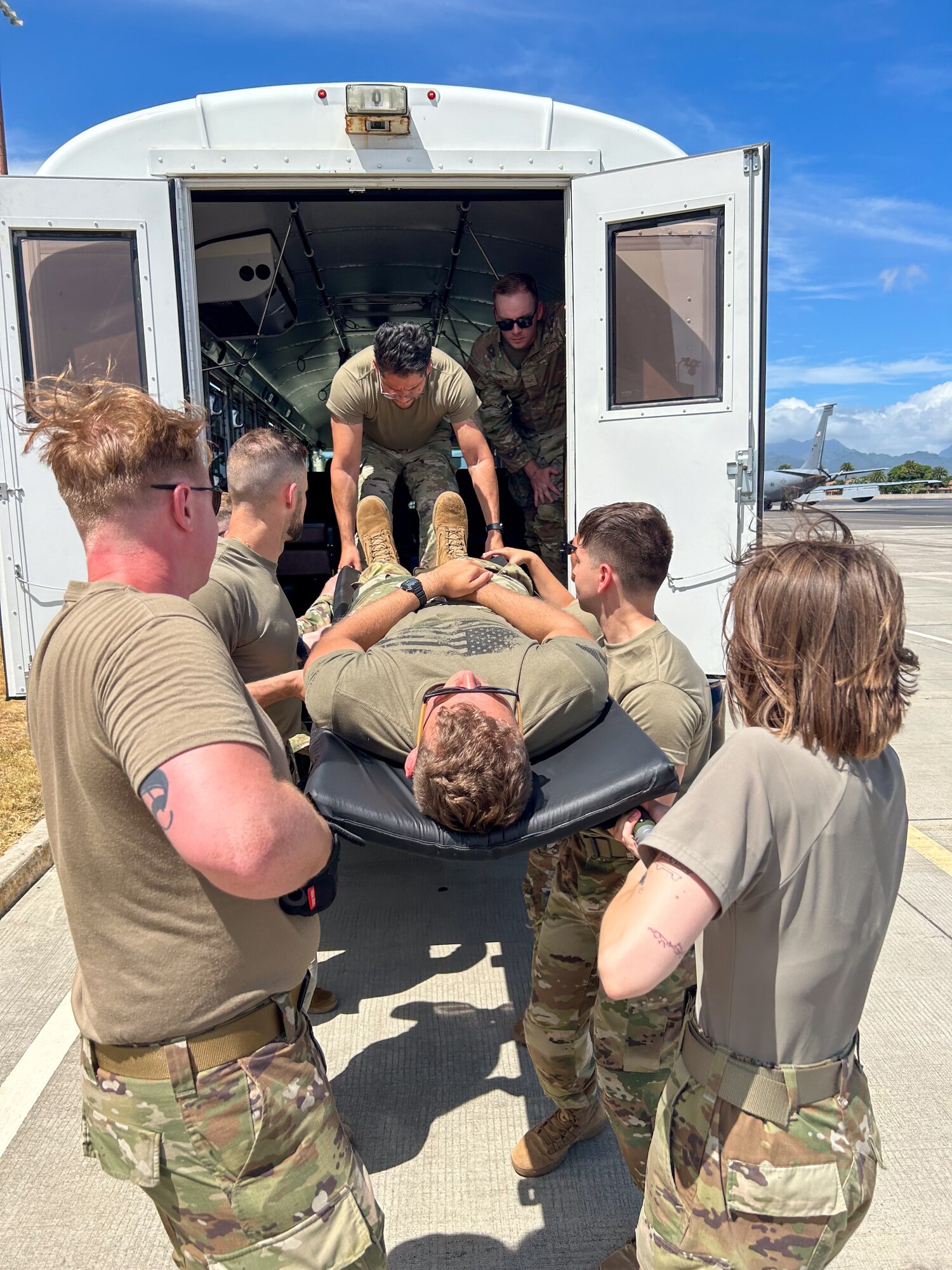 U.S. Airmen assigned to the 115th Fighter Wing practice transporting patients July 24, 2024, at Joint Base Pearl Harbor-Hickam, Hawaii. Airmen assigned to the 115 MDG completed a two-week Medical Facility Annual Training on the island of Oahu to maintain mission readiness. (U.S. Air National Guard photo by Master Sgt. Mary Greenwood)