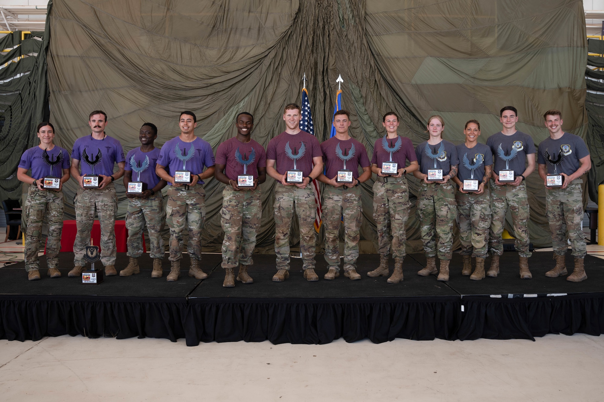 U.S. Airmen pose for a photograph as the top three teams of 2024's Medic Rodeo at Cannon Air Force Base, New Mexico, Aug. 15, 2024. Eglin AFB's 96th Medical Group took first place, Ellsworth AFB's 28th Medical Group came in second, and the 27th Special Operations Medical Group's team came in third. (U.S. Air Force photo by Senior Airman Mateo Parra)