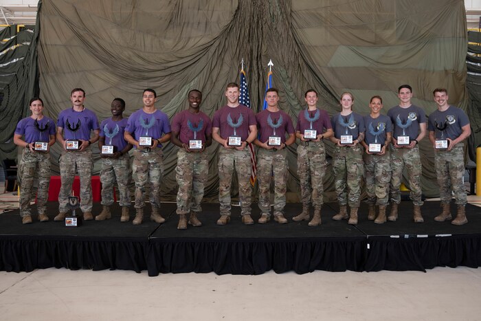 U.S. Airmen pose for a photograph as the top three teams of 2024's Medic Rodeo at Cannon Air Force Base, New Mexico, Aug. 15, 2024. Eglin AFB's 96th Medical Group took first place, Ellsworth AFB's 28th Medical Group came in second, and the 27th Special Operations Medical Group's team came in third. (U.S. Air Force photo by Senior Airman Mateo Parra)