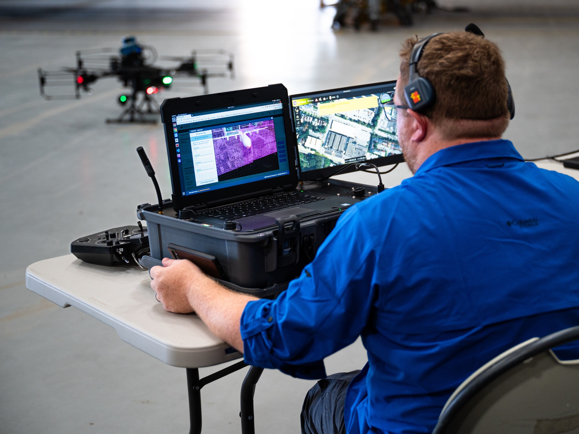 Adam Goodwell, Near Earth Autonomy flight test engineer, analyzes data from NAE’s Customized Action Drone AD-8+ at Dyess Air Force Base, Texas, Aug. 14, 2024. By partnering with small businesses, Boeing innovated processes for Airmen such as detecting anomalies in aircraft. The demonstration of Boeing and NAE’s capabilities allowed Dyess members to see real-time collection, processing, exploitation and dissemination of aircraft data. The data can be processed and stored in a secure government cloud environment allowing Airmen across the world to access and consult experts who have addressed similar anomalies on an airframe. This partnership could enable Airmen to track aircraft data over time, showing consistent anomalies that can help the Air Force innovate preventative maintenance and how they develop future aircraft. (U.S. Air Force photo by Airman 1st Class Jade M. Caldwell)
