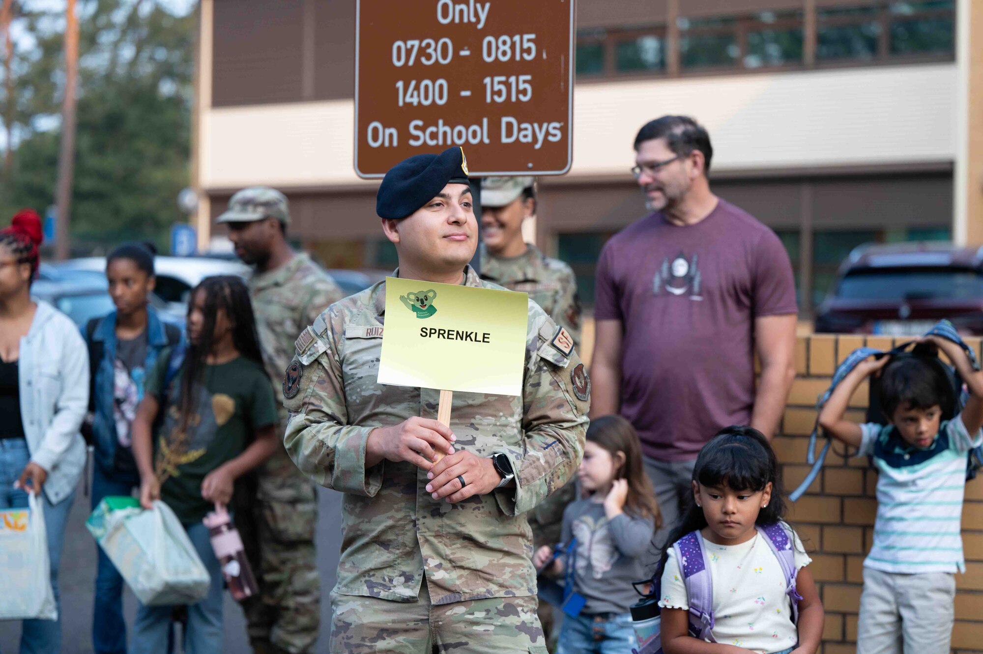 A U.S. Air Force service member helps children find their new teachers at Ramstein Air Base, Germany, Aug. 19, 2024.