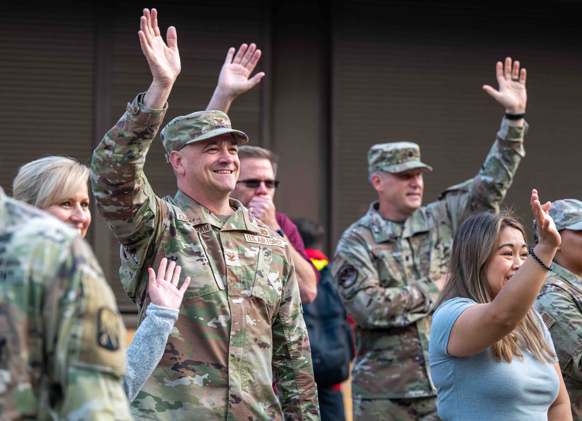 U.S. Air Force Col. James A. Cunningham, 86th Mission Support Group commander, greets children on the first day of the school year at Ramstein Air Base, Germany, Aug. 19, 2024.