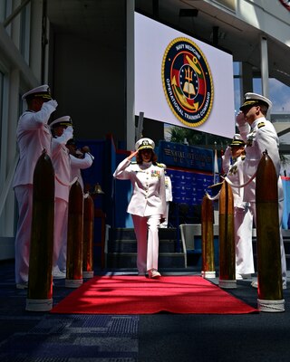 Capt. Nichole Olson is piped ashore for the first time as the new commanding officer during a change of command ceremony for  Navy Medicine Operational Training Command (NMOTC) held aboard Naval Air Station Pensacola, Aug. 14. The Command oversees six detachments and 12 training centers, with facilities in over 60 locations across the United States. These facilities support training programs in aviation, surface and undersea warfare, expeditionary forces, and special operations, providing medical training for the Navy, other U.S. armed forces, and allied nations. (U.S. Navy photo by Mass Communication Specialist 1st Class Russell Lindsey SW/AW)