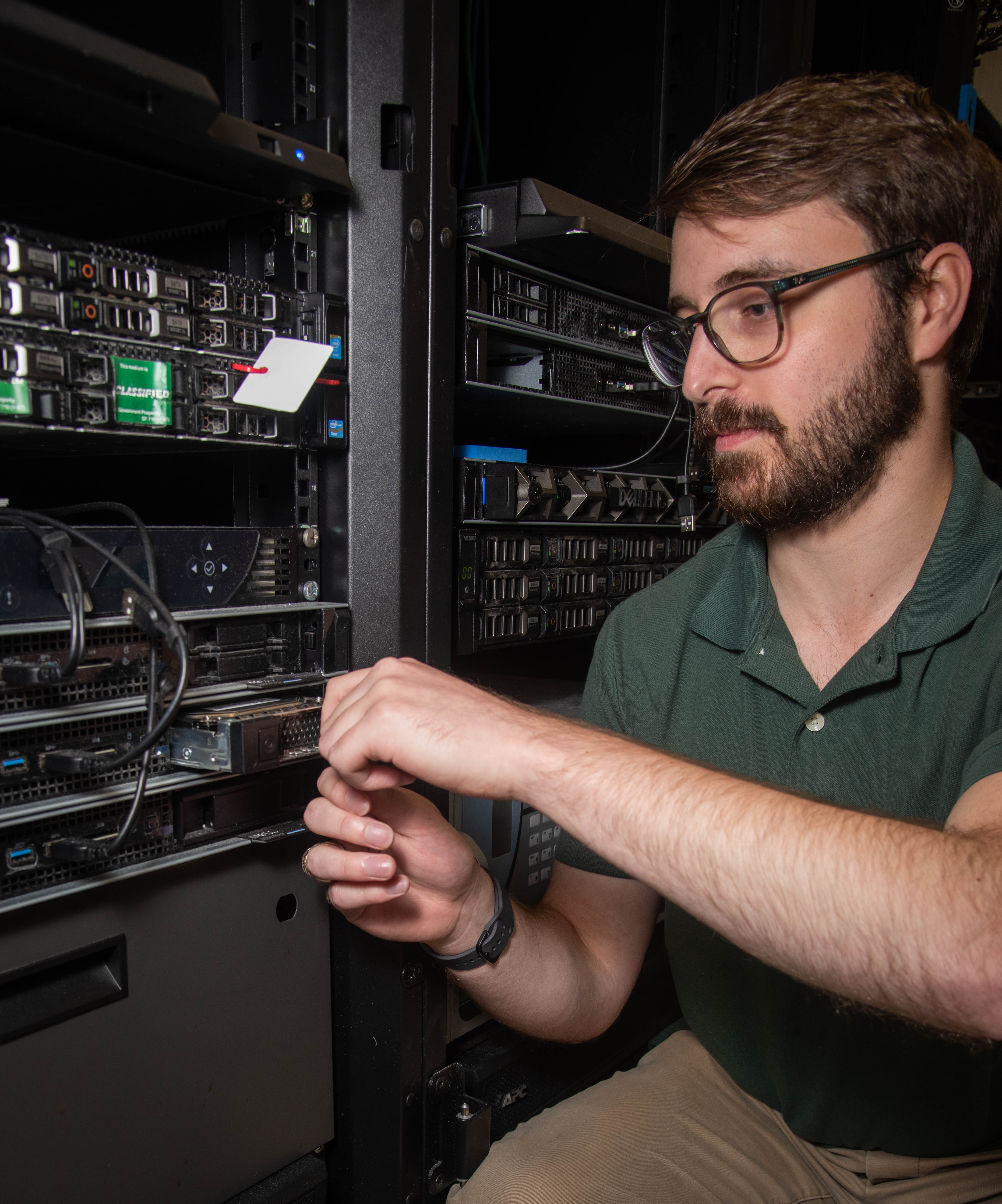 Naval Information Warfare Center (NIWC) Atlantic student intern Dalton Hazelwood installs a hard drive in a server rack. NIWC hosted 94 talented student interns this summer in support of continued learning in STEM and furthering innovation in the information warfare battlespace. Interns got hands-on experience in multiple areas installation and integration of software, cyber operations development for mobile devices, server configuration, vulnerability testing and more. The NIWC Atlantic Student Intern program is designed to provide an internship for students currently enrolled in school at a collegiate level. Students follow a developmental plan that provides a roadmap for potential future employment at NIWC Atlantic.