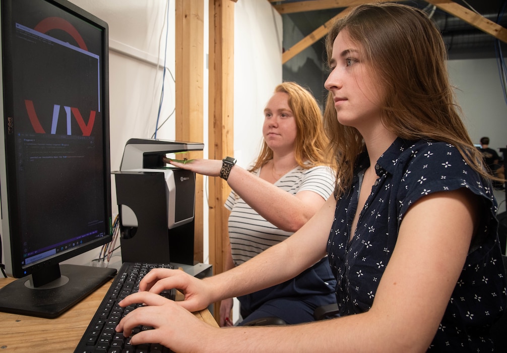 Naval Information Warfare Center (NIWC) Atlantic student intern Emma McBride tests software used in a security system. NIWC hosted 94 talented student interns this summer in support of continued learning in STEM and furthering innovation in the information warfare battlespace. Interns got hands-on experience in multiple areas installation and integration of software, cyber operations development for mobile devices, server configuration, vulnerability testing and more. The NIWC Atlantic Student Intern program is designed to provide an internship for students currently enrolled in school at a collegiate level. Students follow a developmental plan that provides a roadmap for potential future employment at NIWC Atlantic.