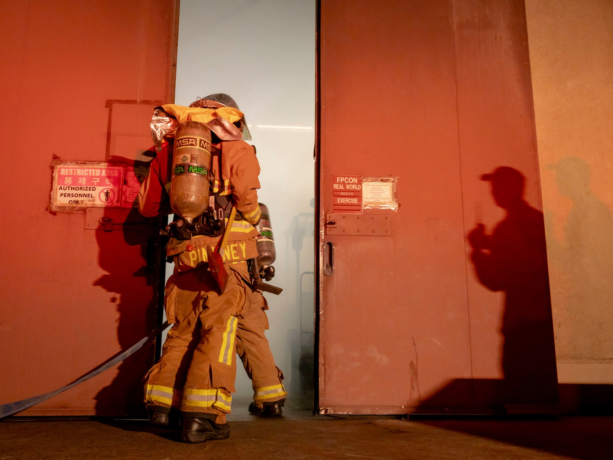 U.S. Air Force firefighters assigned to the 51st Civil Engineer Squadron engage a simulated fire, while a wing inspection team member evaluates their responses, during Ulchi Freedom Shield 24 at Osan Air Base, Republic of Korea, Aug. 18, 2024. The WIT provides feedback during simulated scenarios enabling military members to proficiently execute the mission. Airmen effectively protected and sustained operations by staying equipped, trained, and organized during UFS 24, exhibiting the 51st FW’s "Fight Tonight" mission. UFS24 is an annual combined exercise conducted in support of the U.S.-ROK Mutual Defense Treaty that highlights the U.S. commitment to the alliance. (U.S. Air Force photo by Senior Airman Sabrina Fuller-Judd)