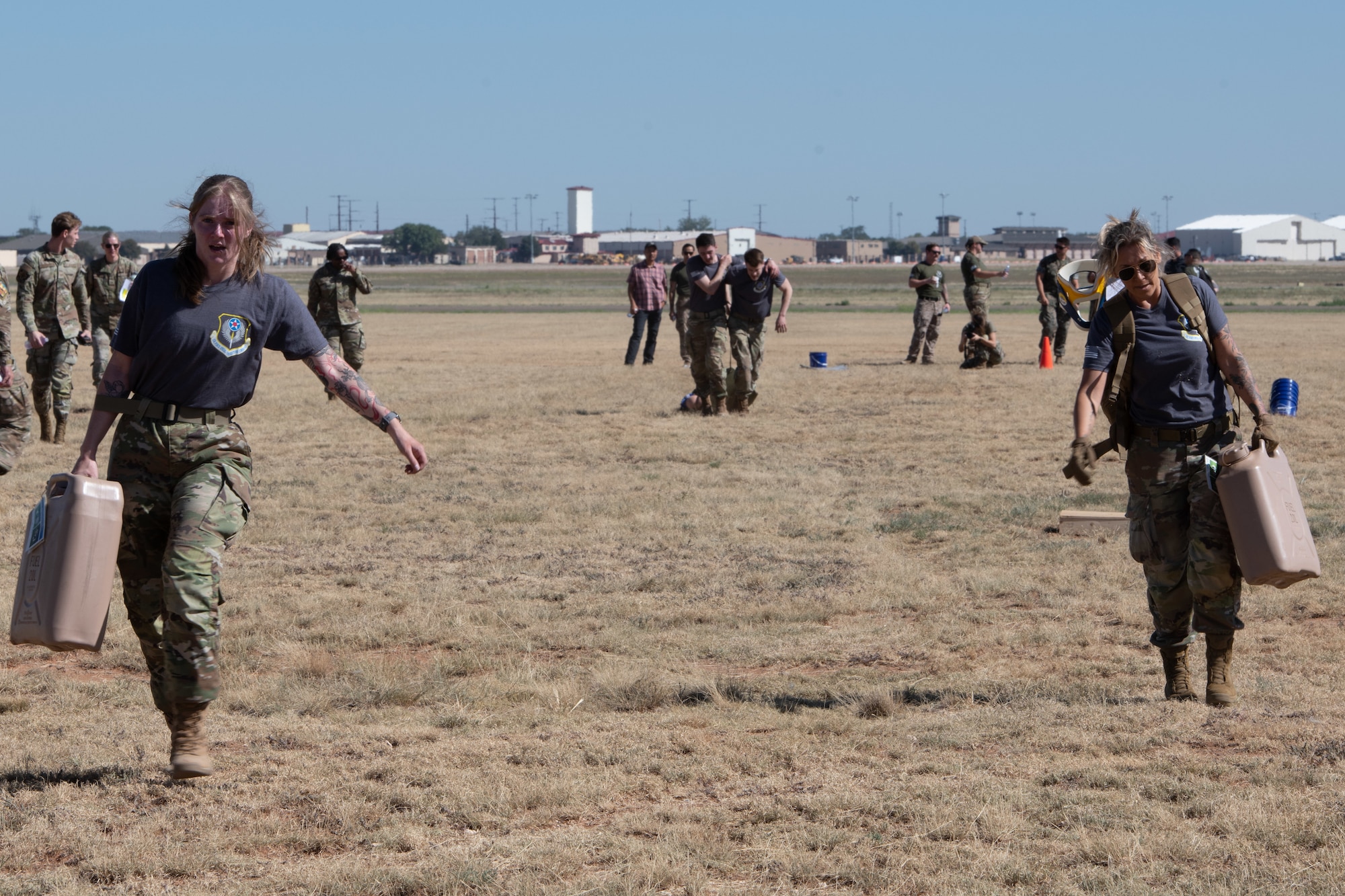 U.S. Airmen assigned to the 27th Special Operations Medical Readiness Squadron participate in the Air Commando Challenge during exercise Medic Rodeo at Cannon Air Force Base, New Mexico, Aug. 15, 2024. In addition to practical scenarios, the 18 competing teams also participated in the Air Commando Challenge, a physically demanding relay which included dragging a simulated patient in a litter over 200 meters. (U.S. Air Force photo by Senior Airman Drew Cyburt)