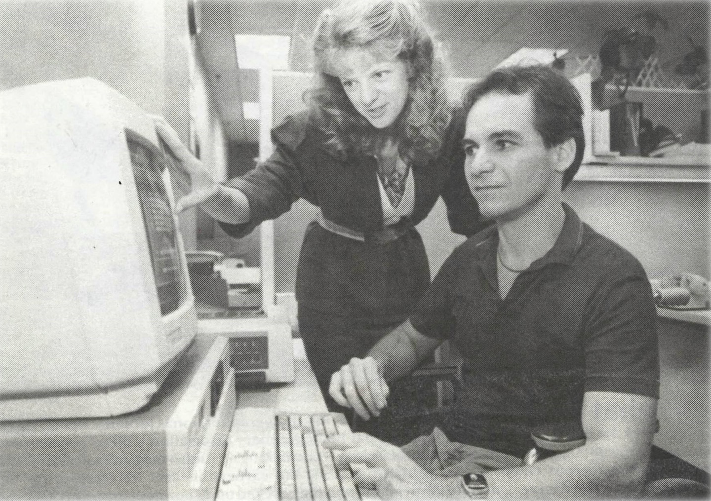 Picture of Marty Rahn at his desk with former coworker Tami Garrett