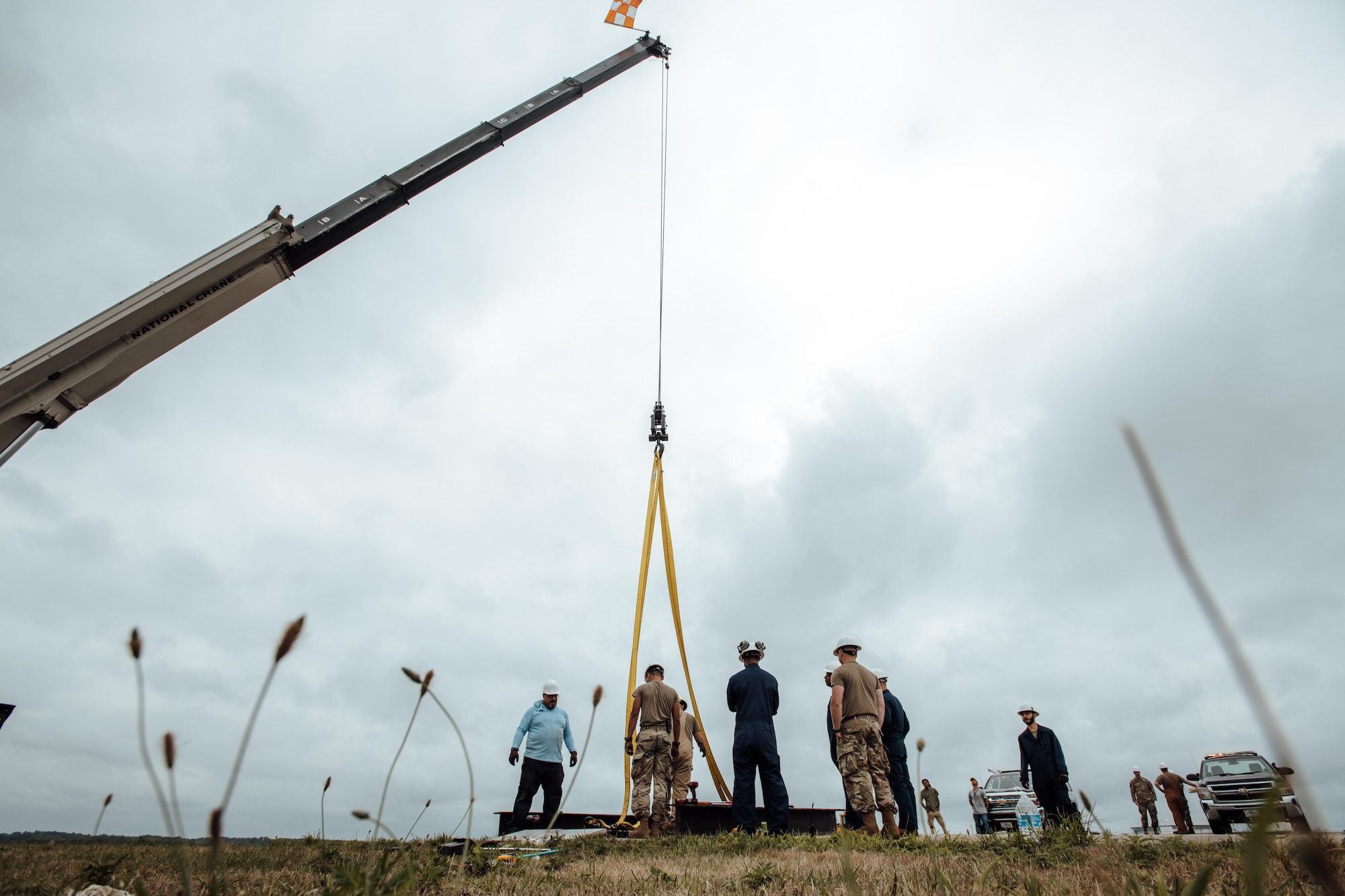 Airmen with the 316th CES direct a beam into place during the overhaul of the BAK-12 aircraft arresting system.