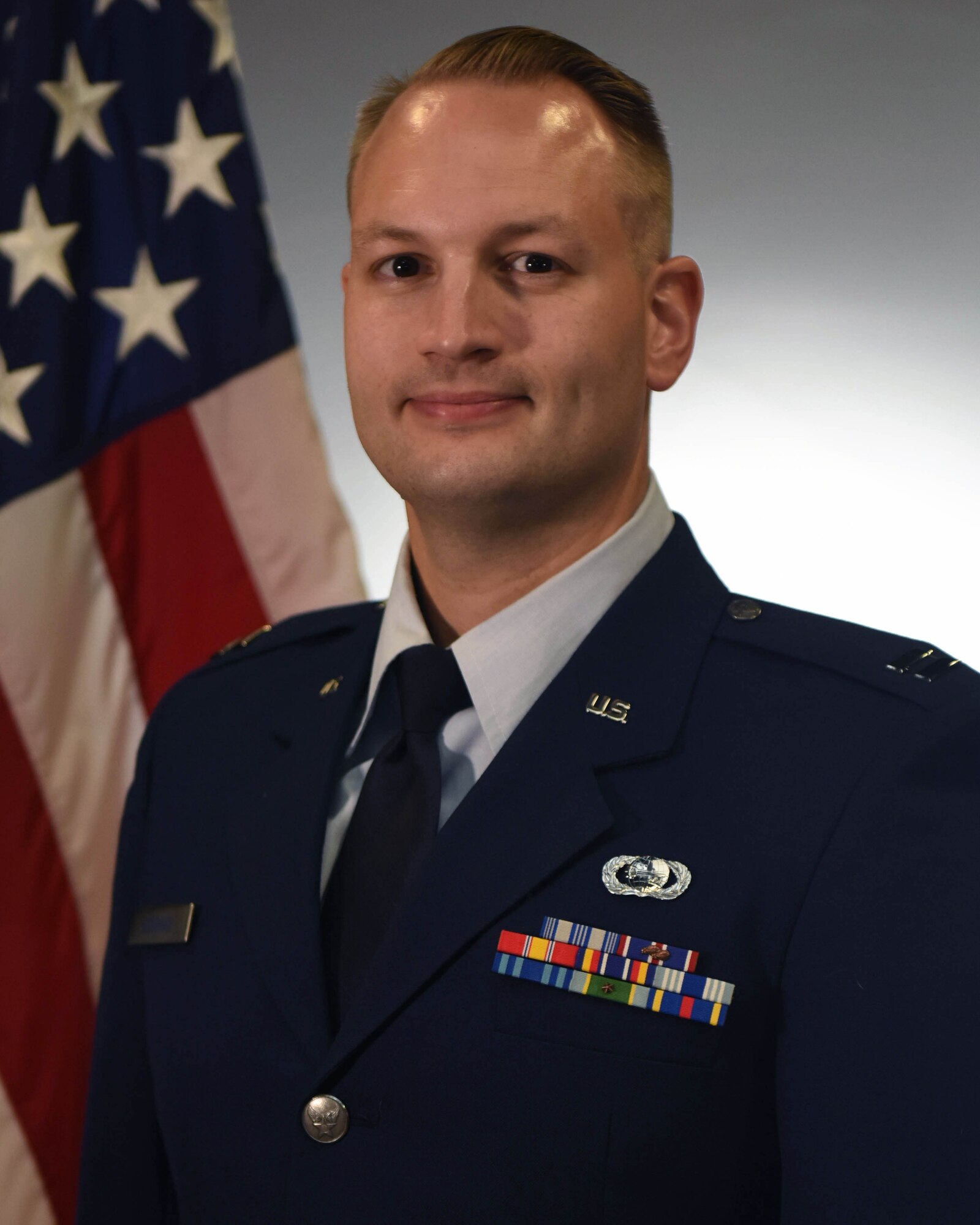 U.S. Air Force Capt. Joshua Bowman, 315th Training Squadron instructor, stands for an official photo at Goodfellow Air Force Base, Texas, June 20, 2024. Military official photos are important for record-keeping, promotions, public display, professionalism and preserving military history. (U.S. Air Force photo by Airman 1st Class Evelyn D’Errico)