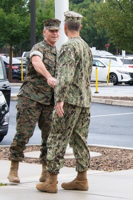 two military officers shaking hands