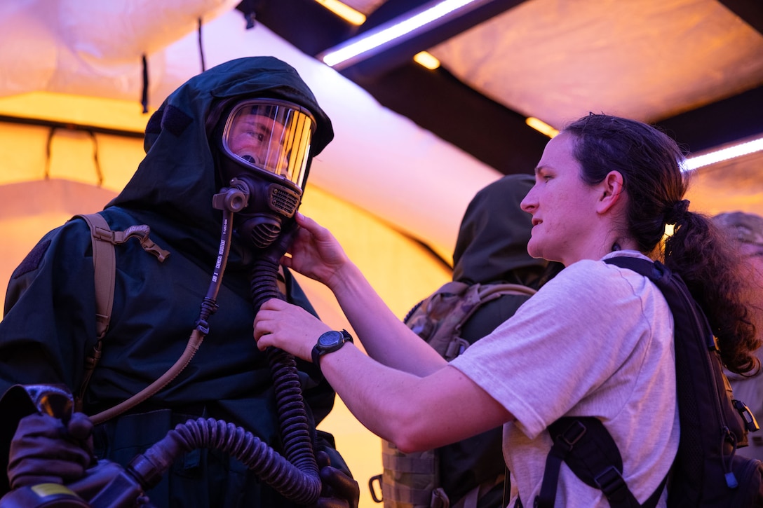 Kentucky Airmen from the CERF-P inspect training MOPP equipment during a joint training exercise with the Georgia National Guard's HRF.