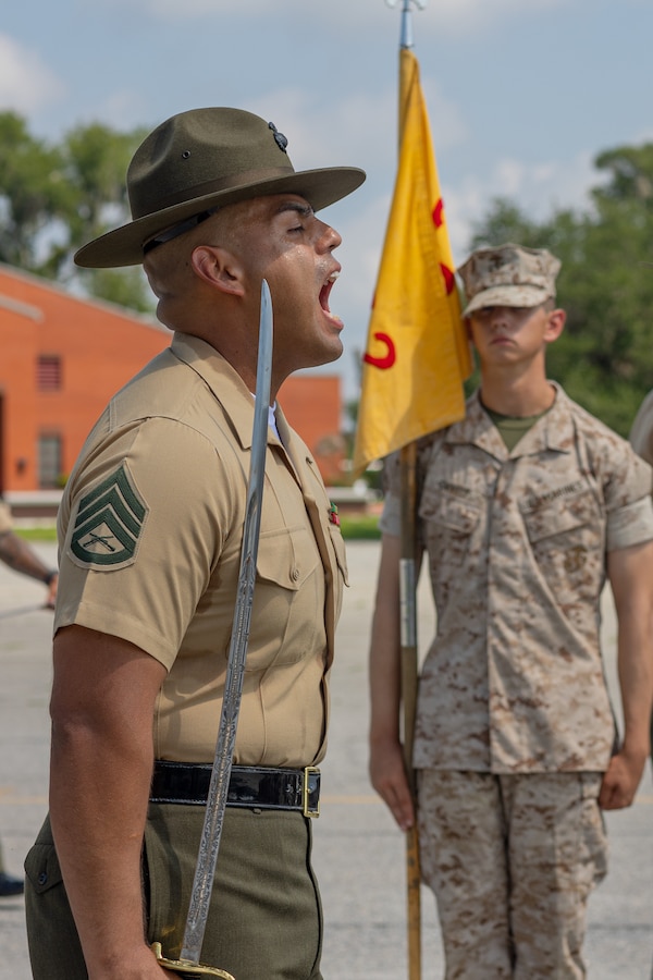 U.S. Marine Corps Staff Sgt. Alexander Rodriguez, a senior drill instructor with Golf Company, 2nd Recruit Training Battalion, gives commands to his platoon as he conducts Final Drill on Marine Corps Recruit Depot Parris Island, S.C., Aug. 10, 2024. Final Drill tests drill instructors on their ability to give drill commands and tests recruits on their ability to execute the movements properly. (U.S. Marine Corps photo by Lance Cpl. Ayden Cassano)
