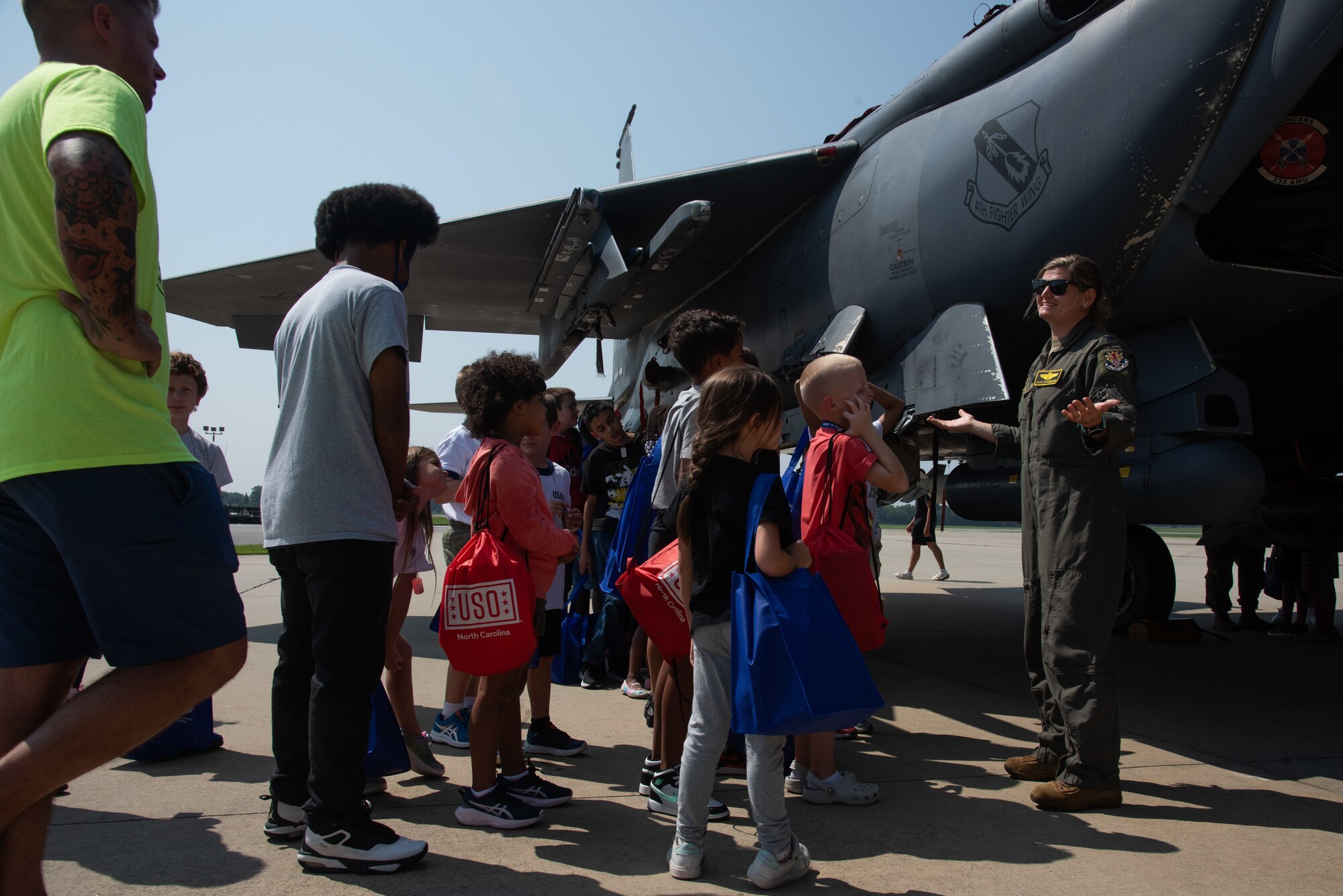 Lt. Col. Bridgett Fitzsimmons, 333rd FS instructor pilot, conducts a tour of an F-15E Strike Eagle for military child dependents during an OPERATION Bug Out ‘kids’ deployment.