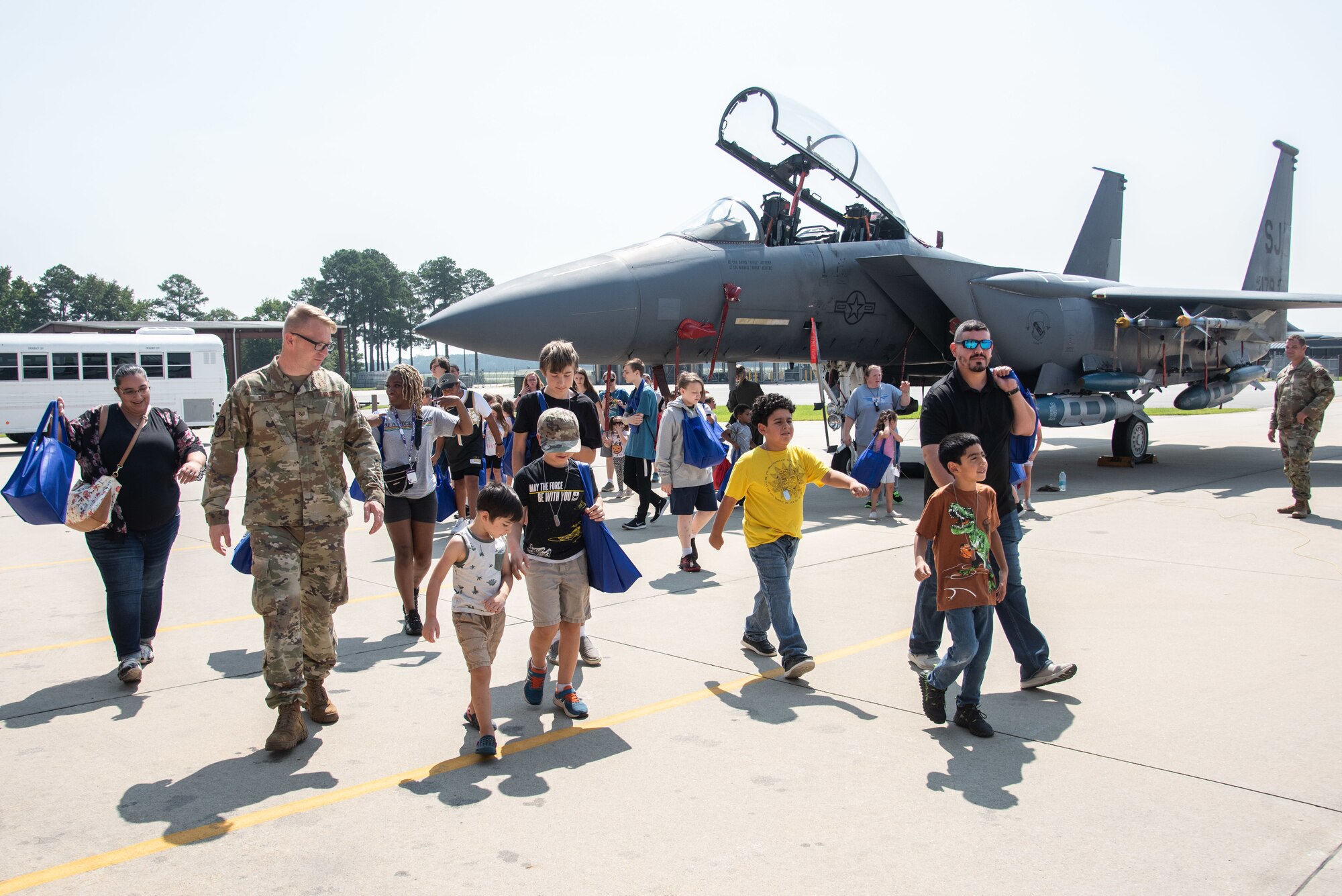 Airmen, civilians and military child dependents complete a tour of an F-15E Strike Eagle during an OPERATION Bug Out ‘kids’ deployment.