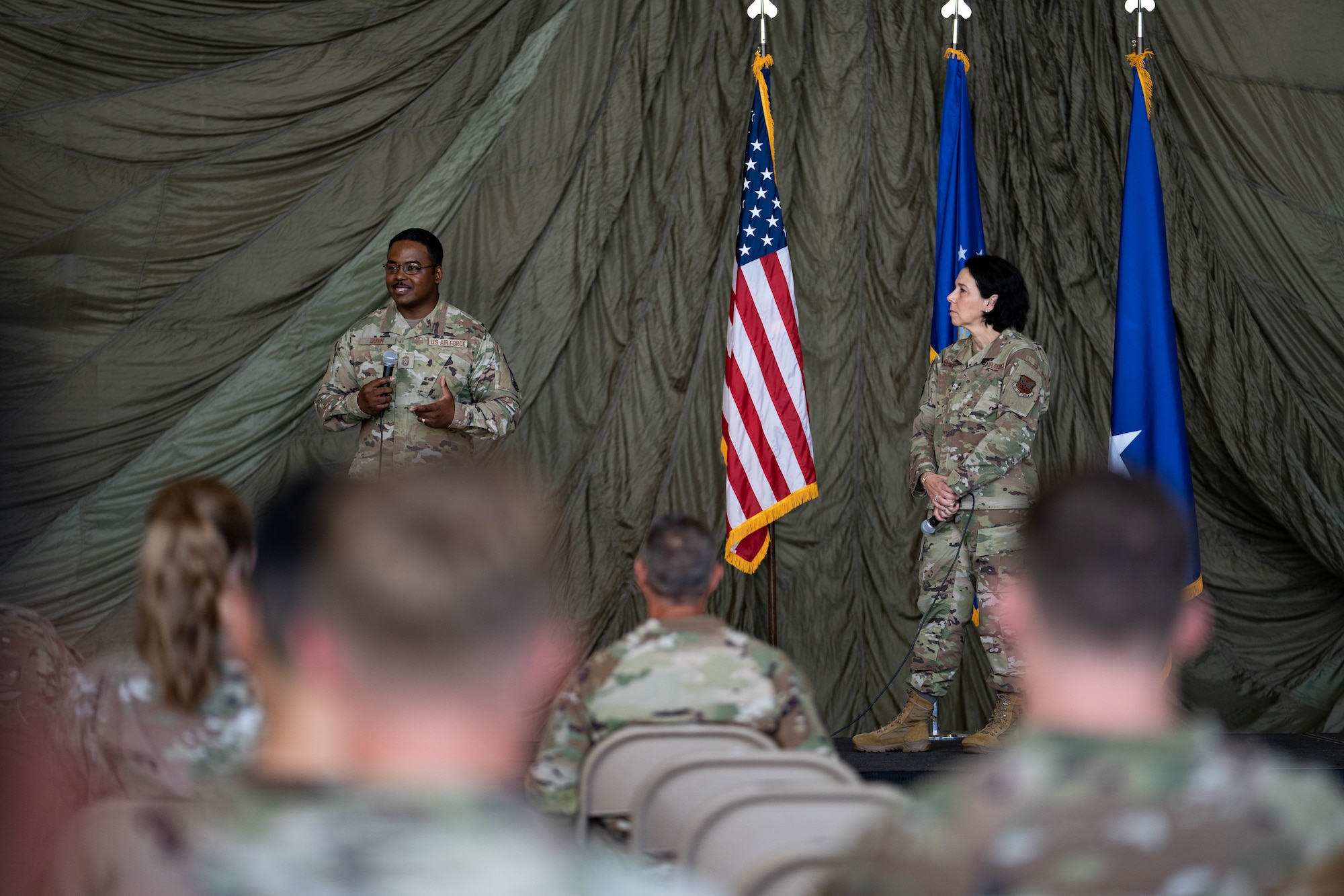 U.S. Air Force Chief Master Sgt. Jerry Dunn, command chief of Air Force Medical Command, and Maj. Gen. Jeannine M. Ryder, commander of the Air Force Medical Agency and director of the Defense Health Network Continental, speak to the 70 participants comprising the 2024 Medic Rodeo at Cannon Air Force Base, New Mexico, Aug. 12, 2024. The objective of Medic Rodeo is to create a prepared joint medical force through realistic and demanding training aimed at emerging readiness needs. (U.S. Air Force photo by Senior Airman Mateo Parra)