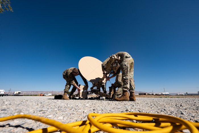 U.S. Air Force Airmen assigned to the 52nd Combat Communications Squadron, Robins Air Force Base, Georgia, set up a satellite communications dish