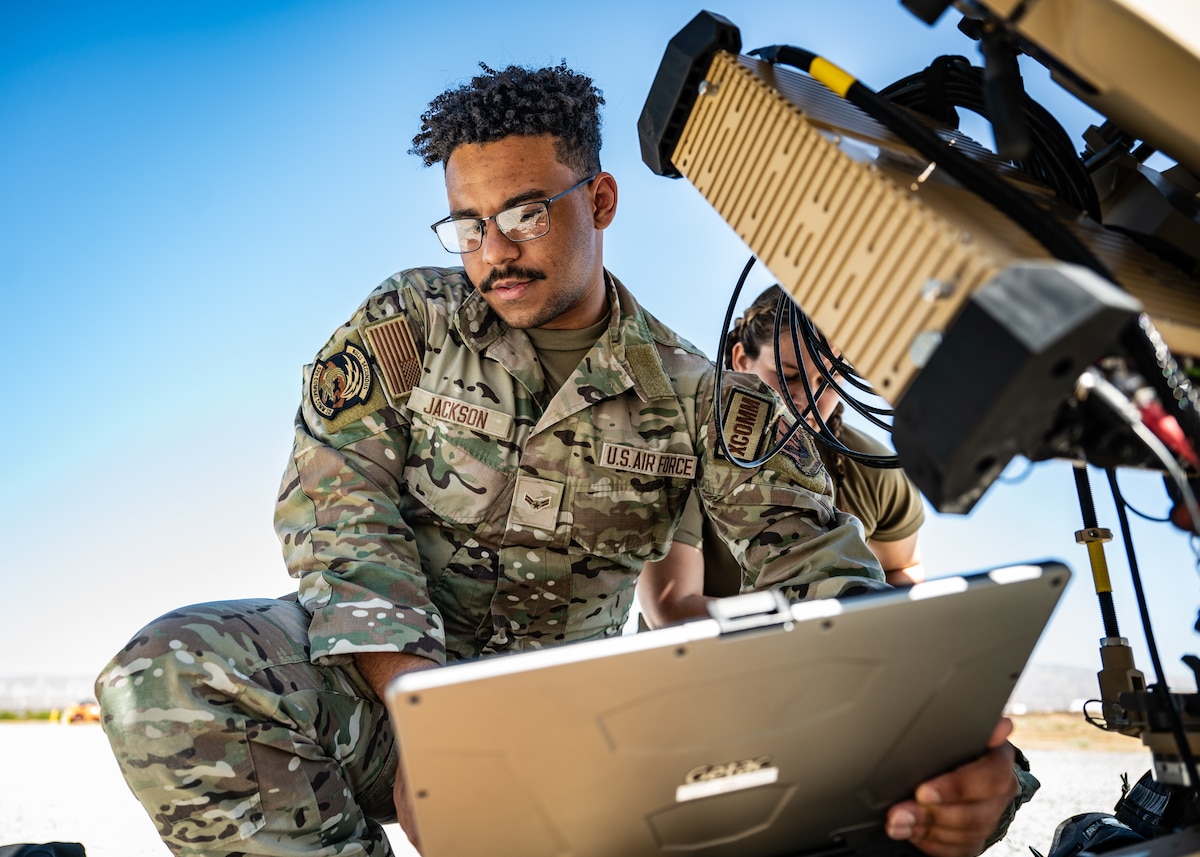 U.S. Air Force Airman 1st Class Czar Jackson, Robins Air Force Base, Georgia, 52nd Combat Communications Squadron initial communications technician, sets up a satellite communications dish
