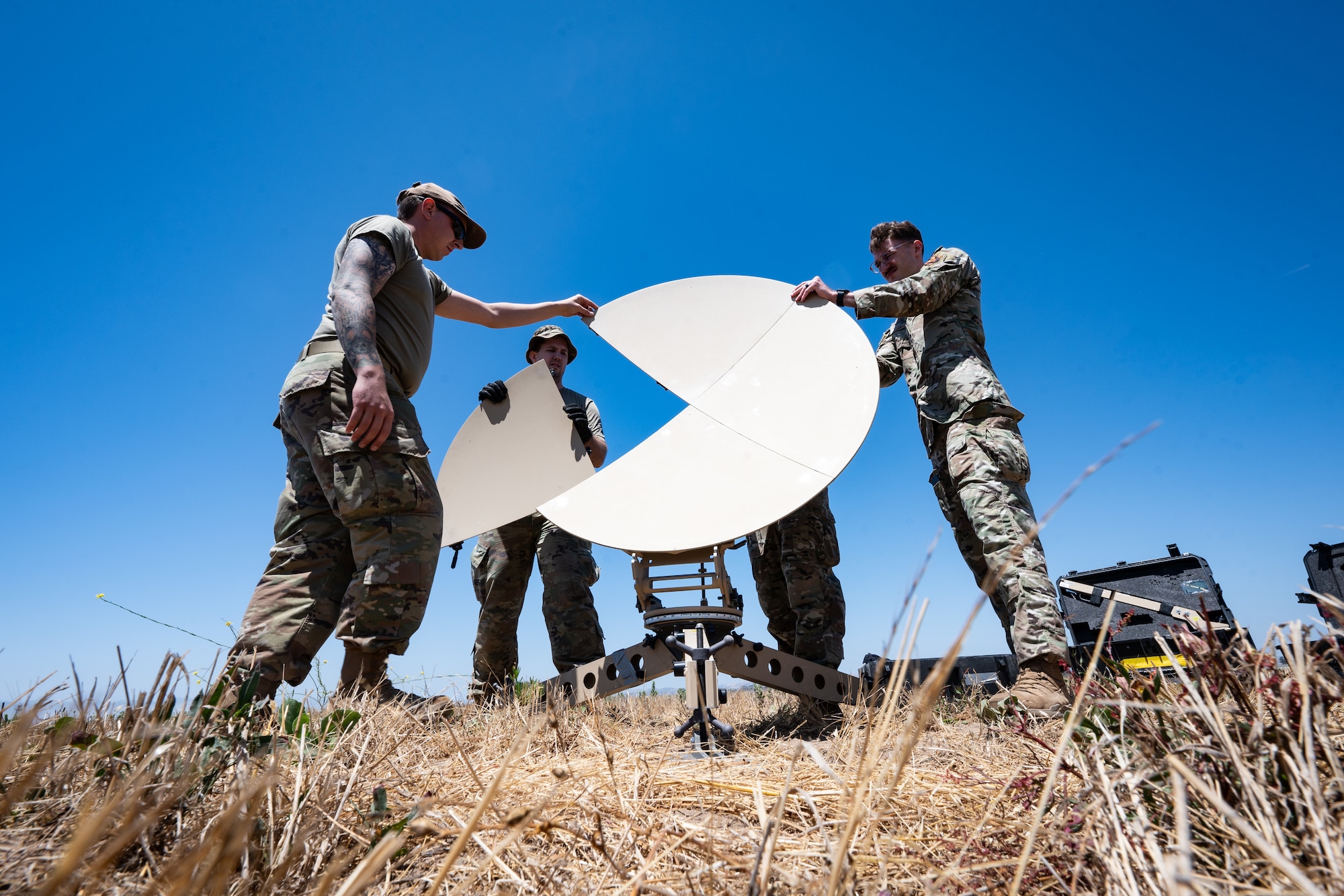 Airmen assigned to Robins Air Force Base, Georgia, 52nd Combat Communications Squadron, set up a satellite communications dish