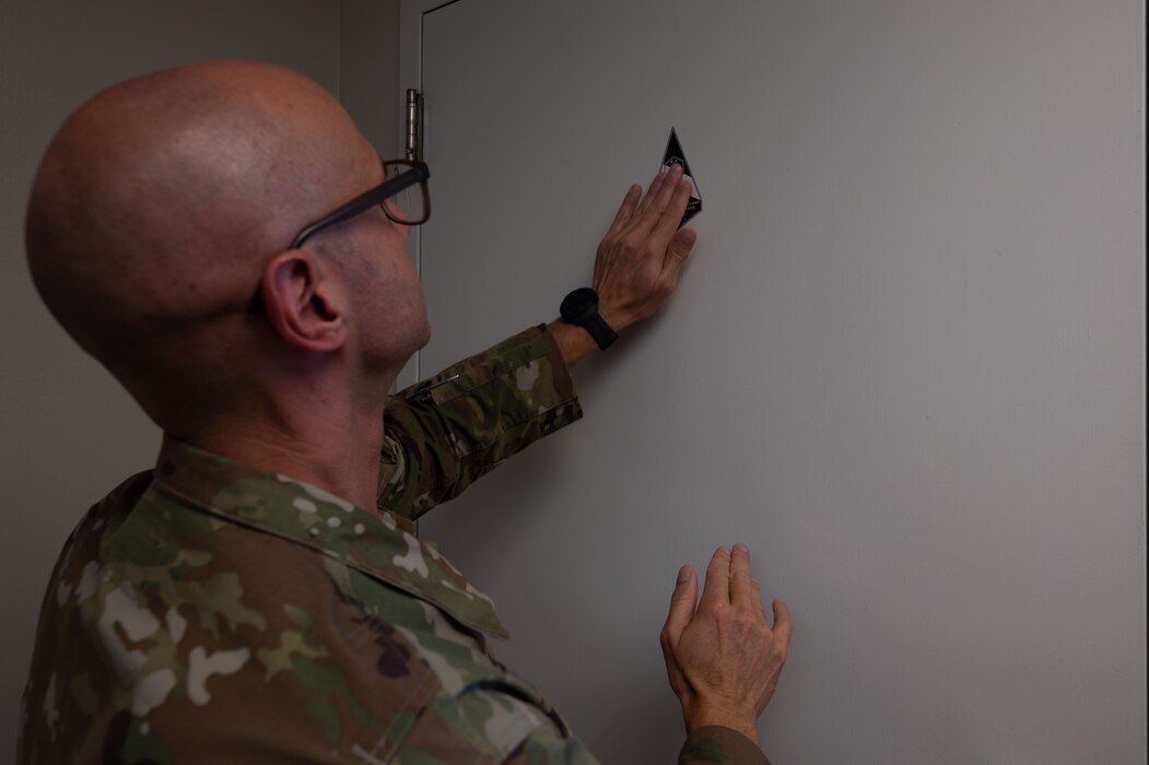 Chief Master Sergeant of the Space Force John Bentivegna leaves a sticker in the Space Force Detachment 1 dayroom at Goodfellow Air Force Base, Texas, Aug 16, 2024. Bentivegna wanted to see the living conditions of the Guardians that come through Goodfellow during technical training. (U.S. Air Force photo by Airman 1st Class Brian Lummus)