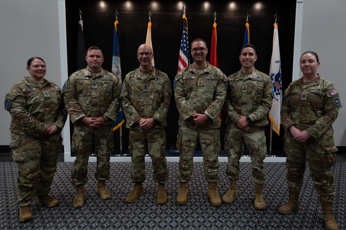 Chief Master Sergeant of the Space Force John Bentivegna poses with Space Force Detachment 1 staff at the Powell Event Center, Goodfellow Air Force Base, Texas, Aug. 16, 2024. Bentivegna spoke on the role of the Space Force in the Department of Defense and how the current Guardians are shaping the identity and culture of the service. (U.S. Air Force photo by Airman 1st Class Brian Lummus)