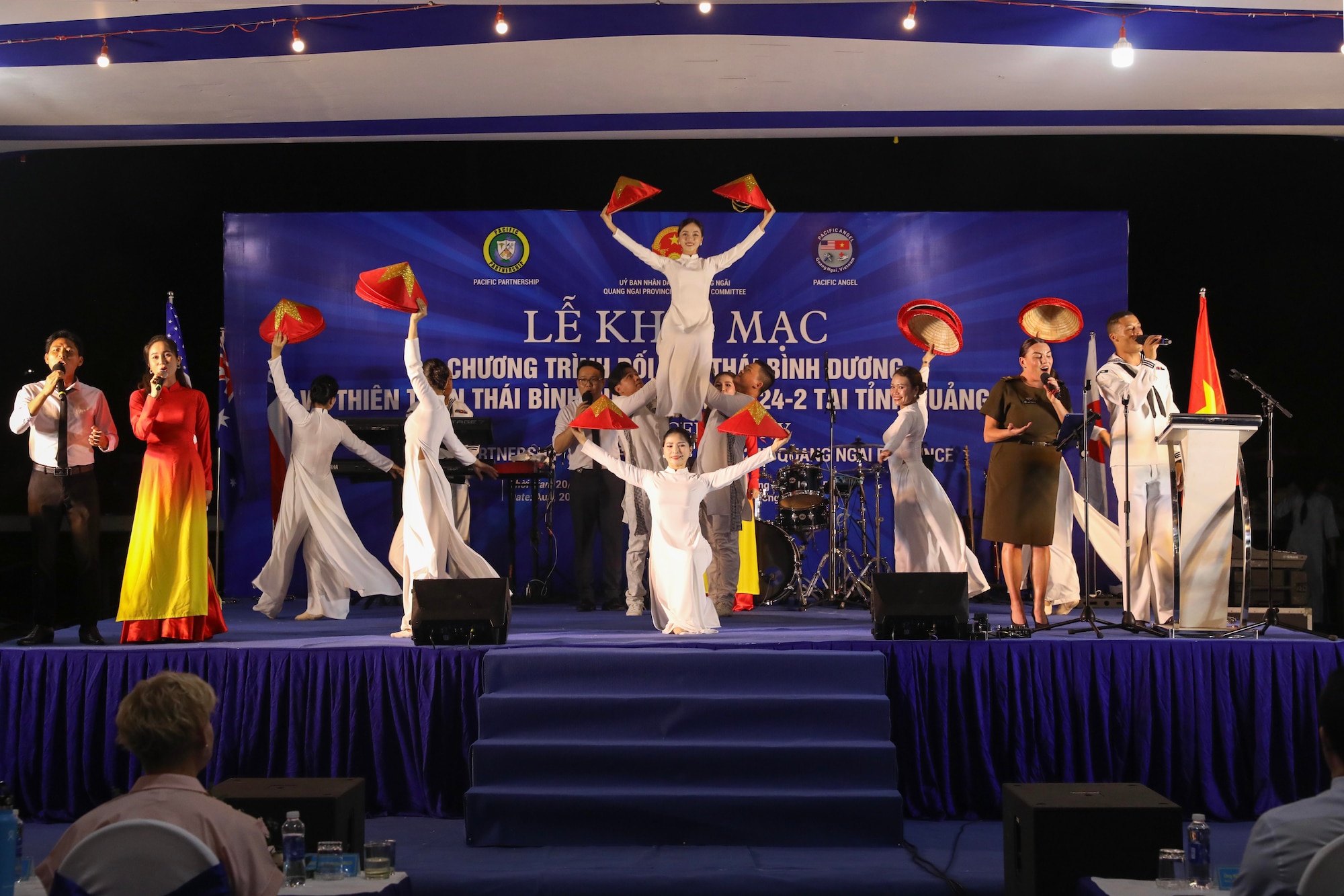 QUANG NGAI, Vietnam (Aug. 20, 2024) – The Pacific Partnership 2024-2 Band performs on stage with artists from the Quang Ngai Provincial Cultural and Arts Center at the opening ceremony of PP24-2 and Pacific Angel 2024-3 at Pham Van Dong Square in Quang Ngai, Vietnam, Aug. 20, 2024.