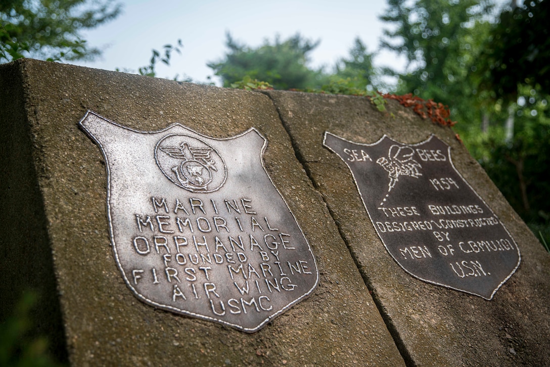 Plaques placed by 1st Marine Air Wing and Seabees with Naval Construction Maintenance Unit 101 mark the original building site of the Sunrin Aeyukwon Children’s Home in Pohang, South Korea, Aug. 19, 2024.