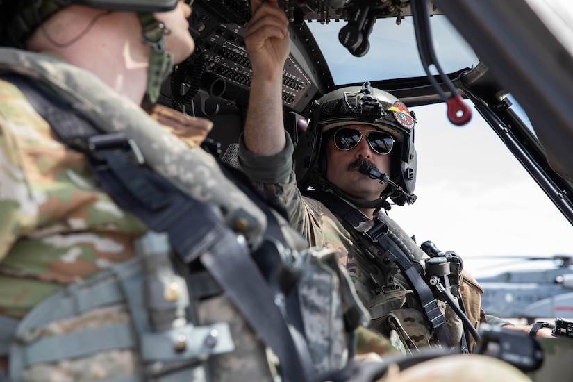 Soldiers of the 2-147th Assault Helicopter Battalion, 63rd Theater Aviation Brigade, perform a helocast demonstration as part of the Thunder Over Louisville’s Air Show in Louisville, Kentucky, April 20, 2024.