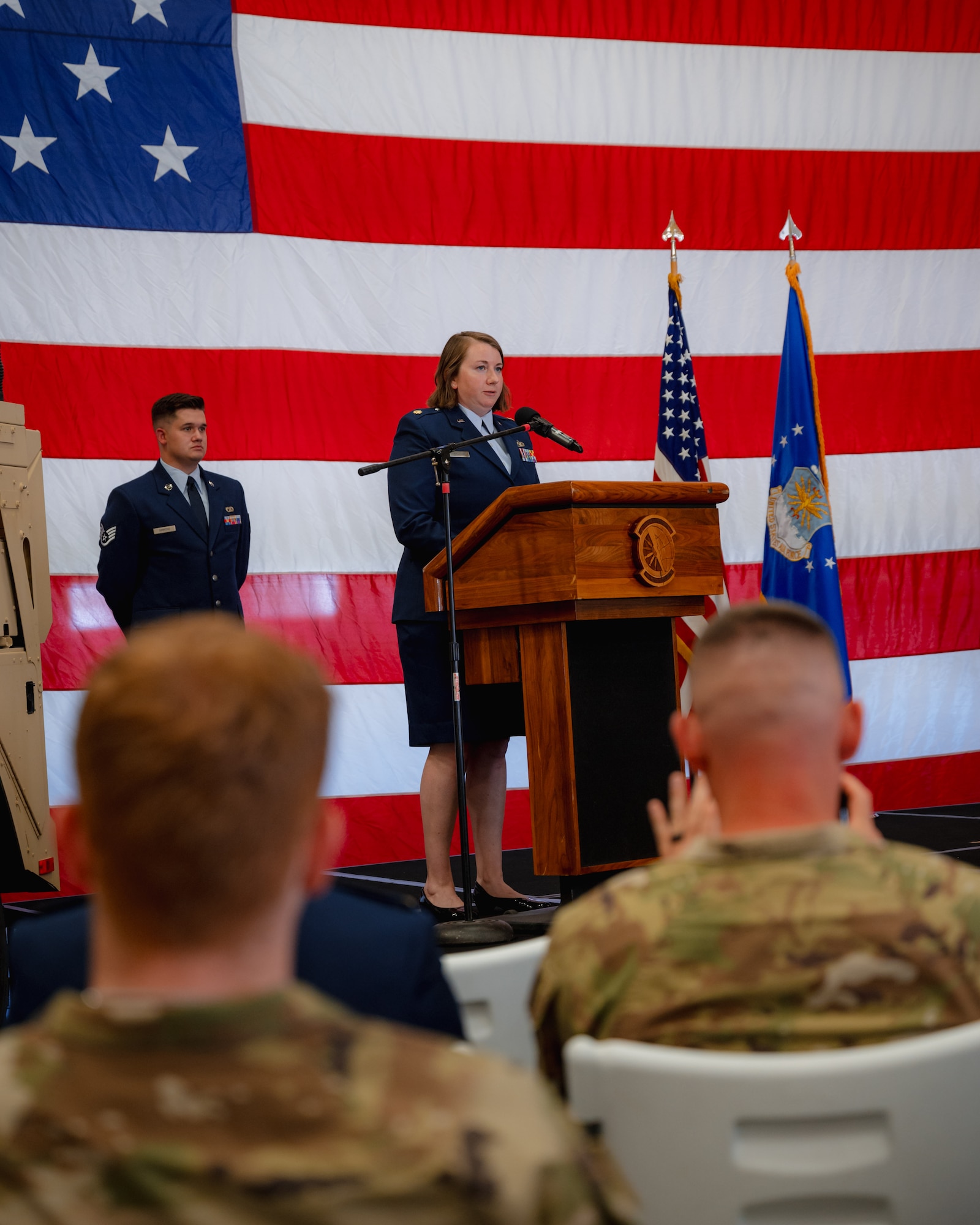 Maj Jenna Donaldson speaks at a change of command ceremony.