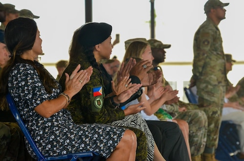 Filipino Army Air Traffic Controller and recently graduated Defense Language Institute English Language Center student, First Lieutenant Febe Salina Acenas, attends her cousin, Lt. Col. Matthew Redaja’s, change of command ceremony at Joint Base San Antonio-Lackland, Texas, June 10, 2024.