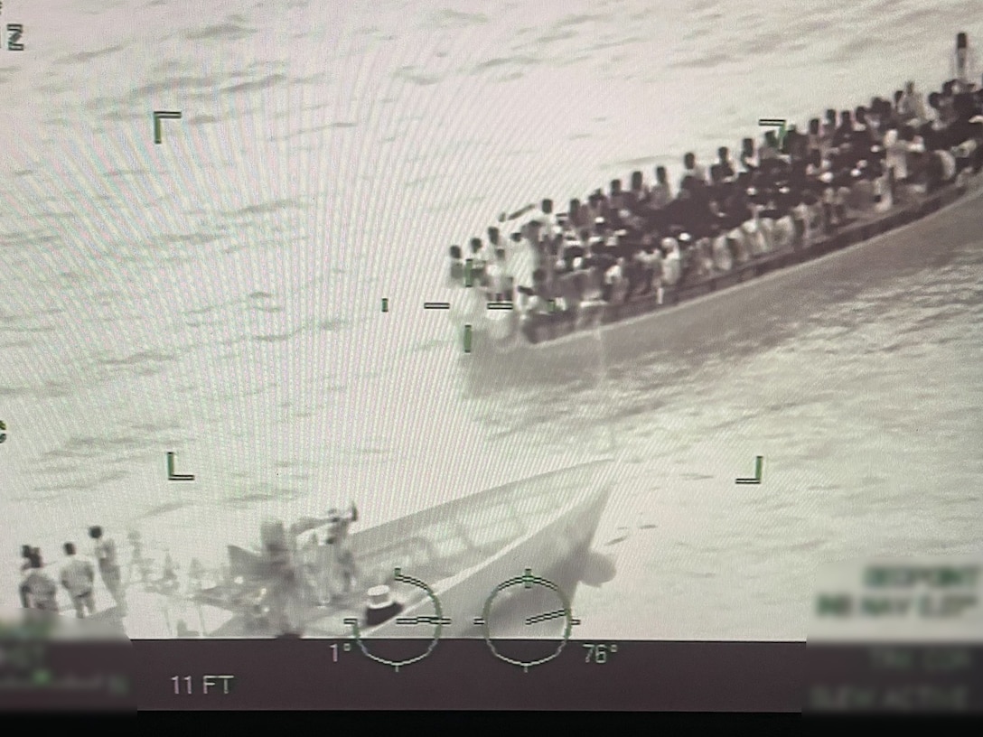 A small boat crew from the Coast Guard Cutter Paul Clark interdicting a migrant venture 57 miles south of Turks and Caicos Islands August 17, 2024. The boat crew distributed life vests before the cutter could embark the migrants.