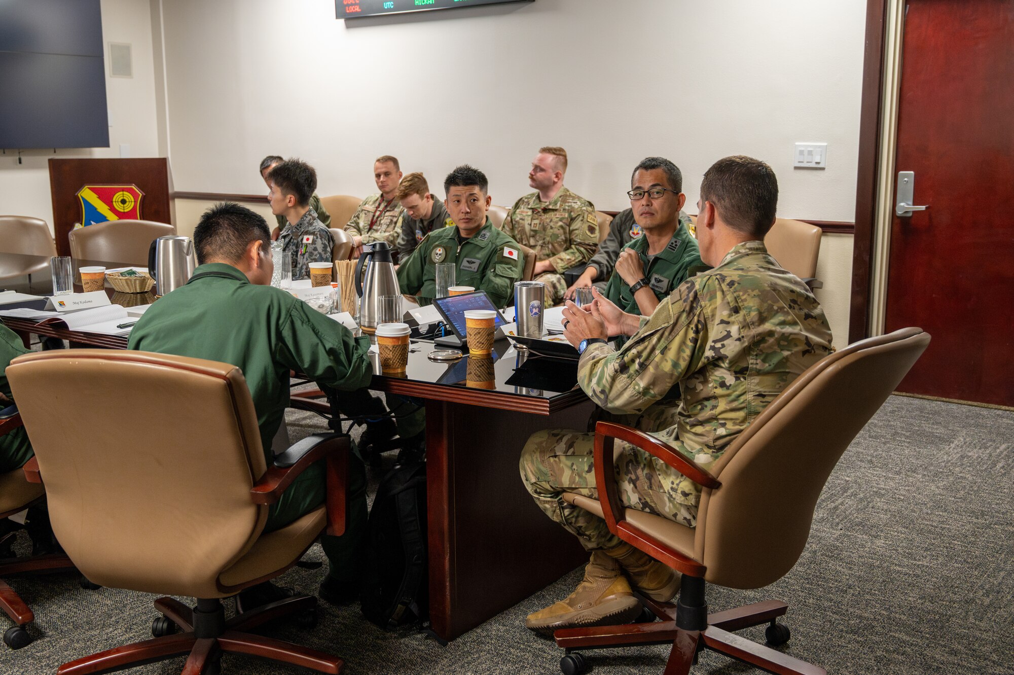 U.S. Air Force 57th Information Aggressor Squadron (IAS) commander, briefs members of the Japan Air Self Defense Force