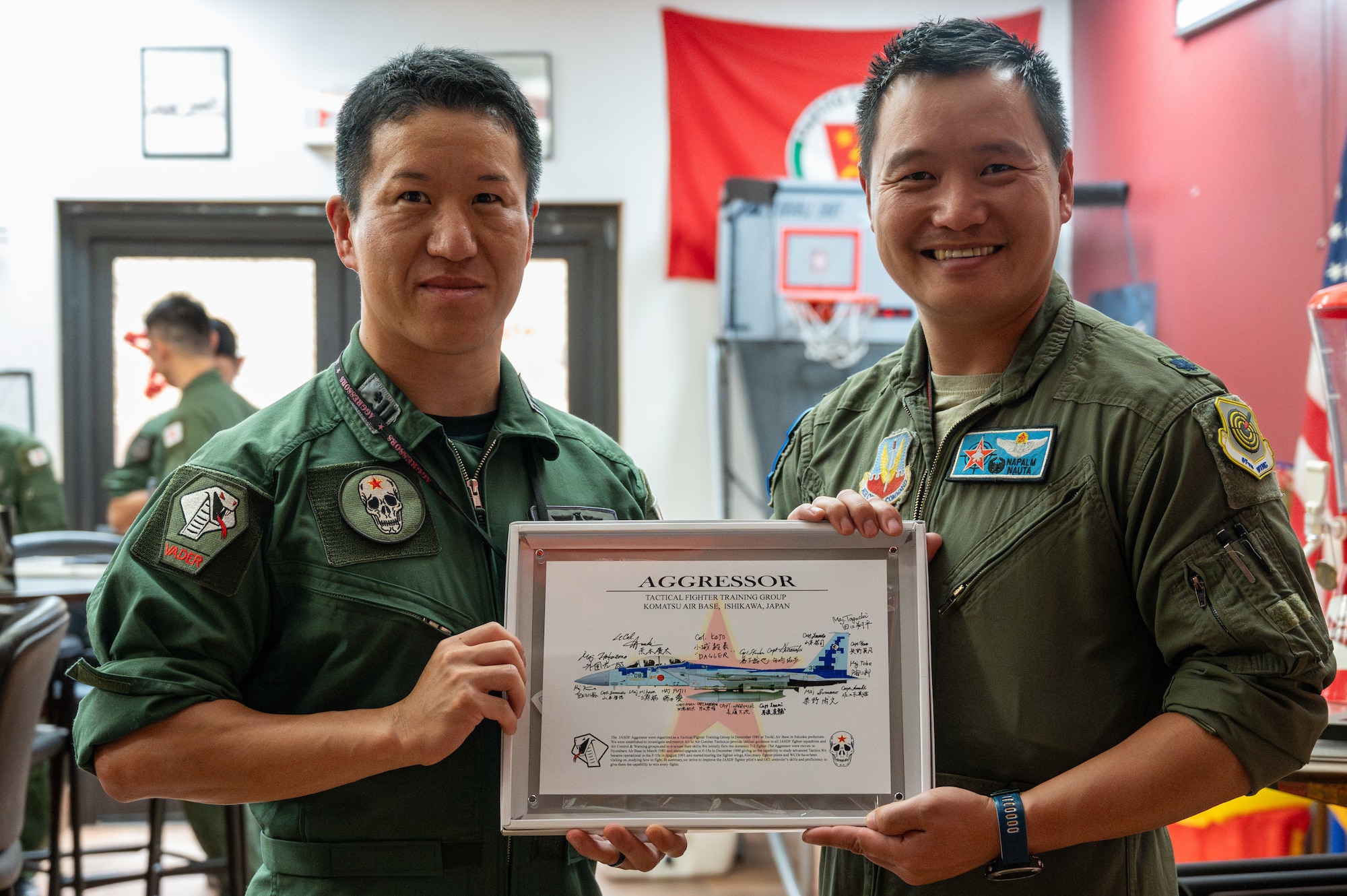 Japan Air Self Defense Force Airman gives a gift to U.S. Air Force 65th Aggressor Squadron (AGRS) commander