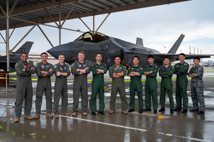 Members of the U.S. Air Force (USAF) and Japan Air Self Defense Force pose for a photo in front of an F-35A Lightning II