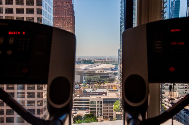 Downtown Los Angeles can be seen out the window between two treadmills. The U.S. Army Corps of Engineers Los Angeles District has a gym available for employee use, free of charge at its headquarters in Los Angeles. The gym has two workout areas, which are stocked with a plethora of items, including exercise bikes, treadmills, weight machines, free weights, Ping-Pong tables, punching bags and more.