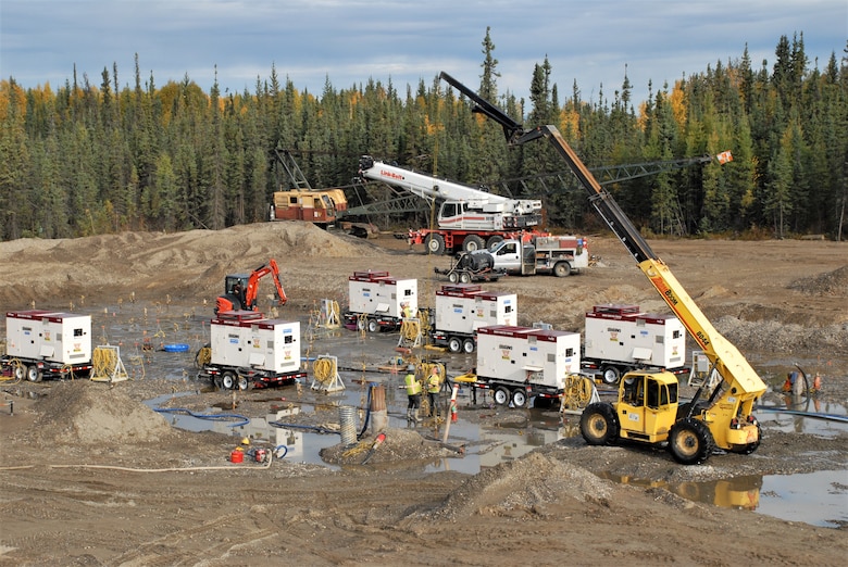At some of the construction sites, the soil was thawed prior to constructing the foundations. For construction of the missile maintenance facility, contractors inserted pipes in a grid pattern at the site to carry hot water down underground to thaw permafrost. The water was pumped back to the surface for reheating and the cycle continued until the ground was melted evenly across the site. After construction was complete, the building’s heat now ensures the soil does not freeze again.